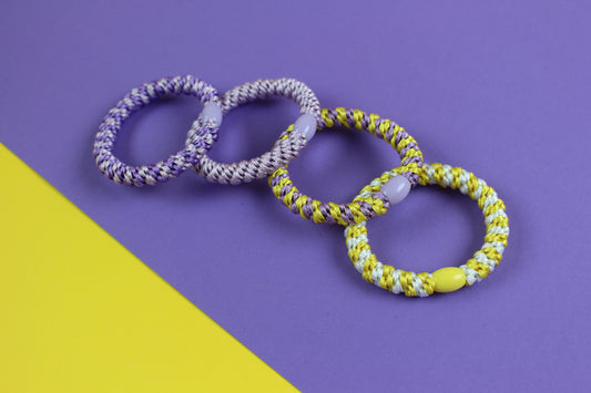 Ava&Yves Haargummi-Set gelb flieder mit 4 Haargummis in runder Geschenkbox